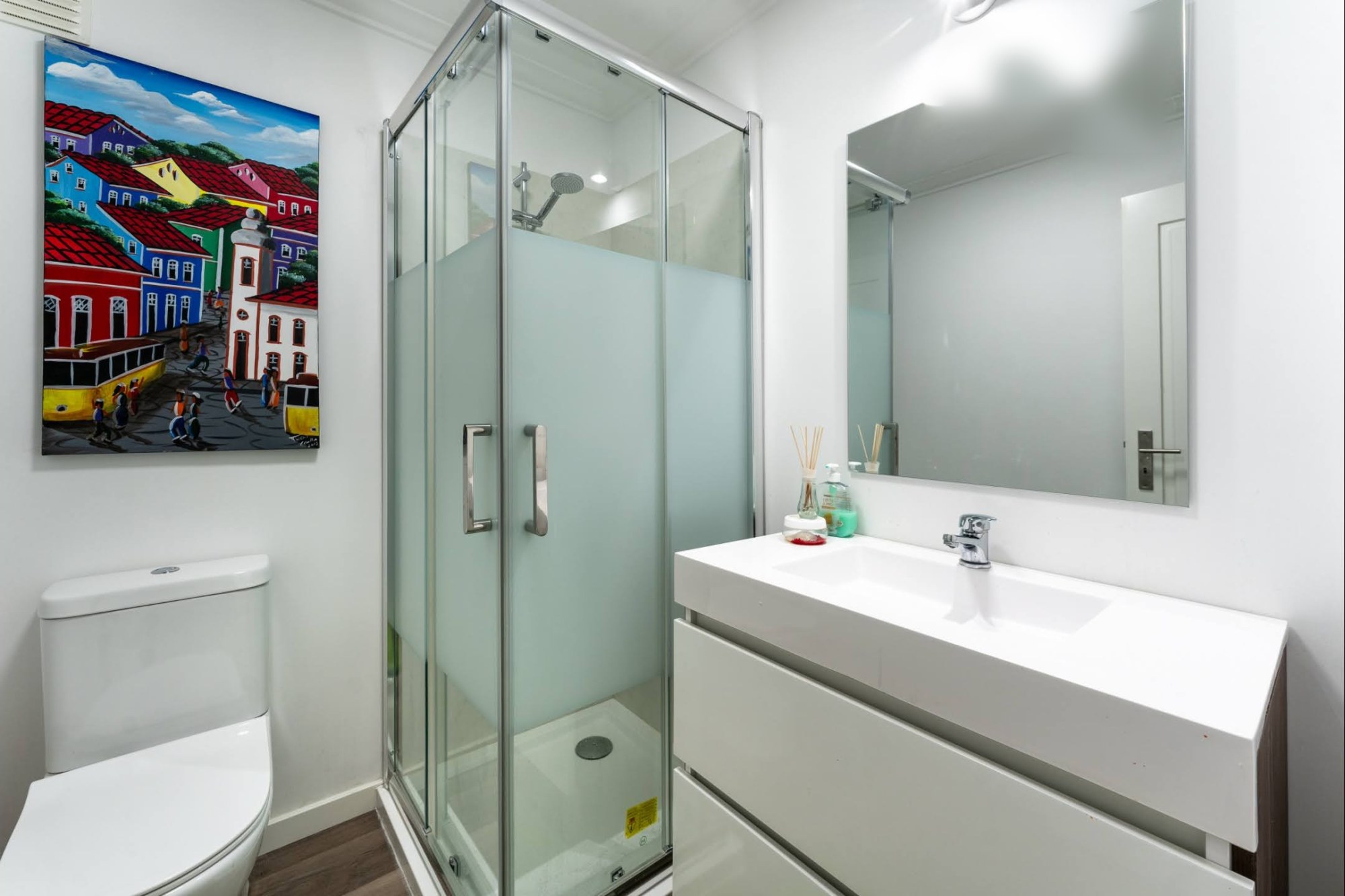 Staff Ensuite Bedroom #9 compact ensuite with shower, toilet, sink and vanity