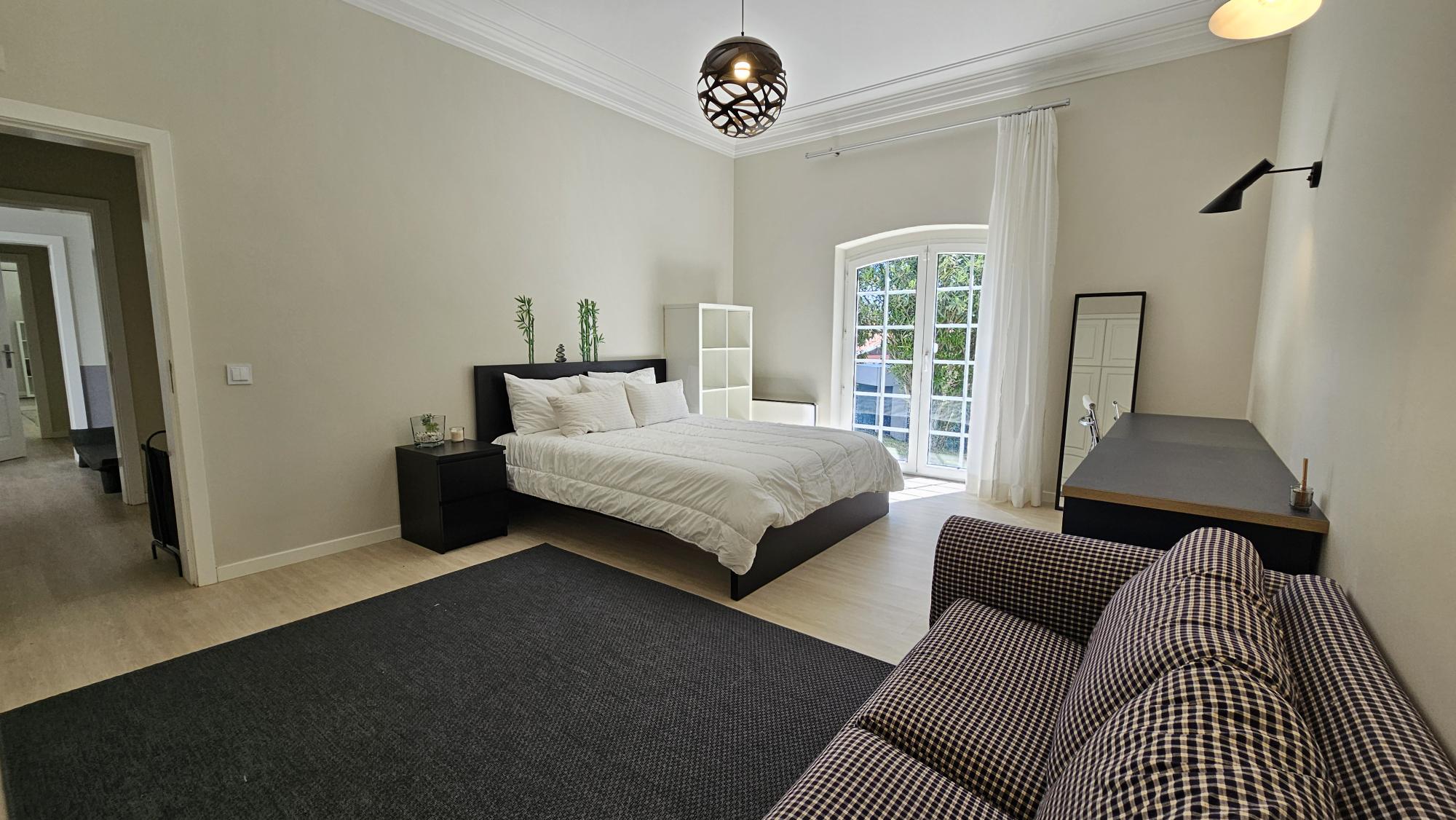 Ensuite Bedroom #3 with king bed and garden doors