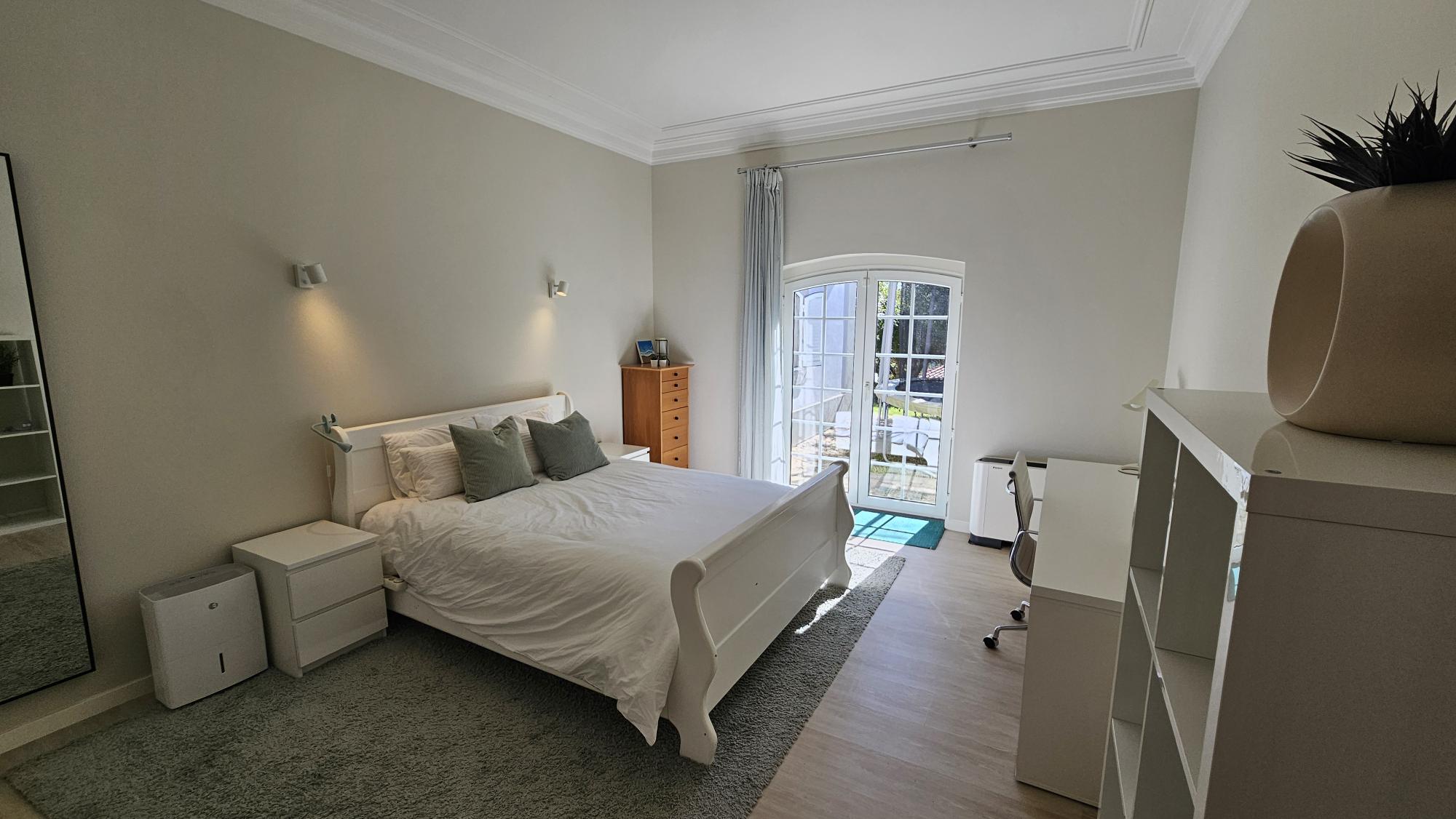 Ensuite Bedroom #4 white sleigh bed and vinyl records
