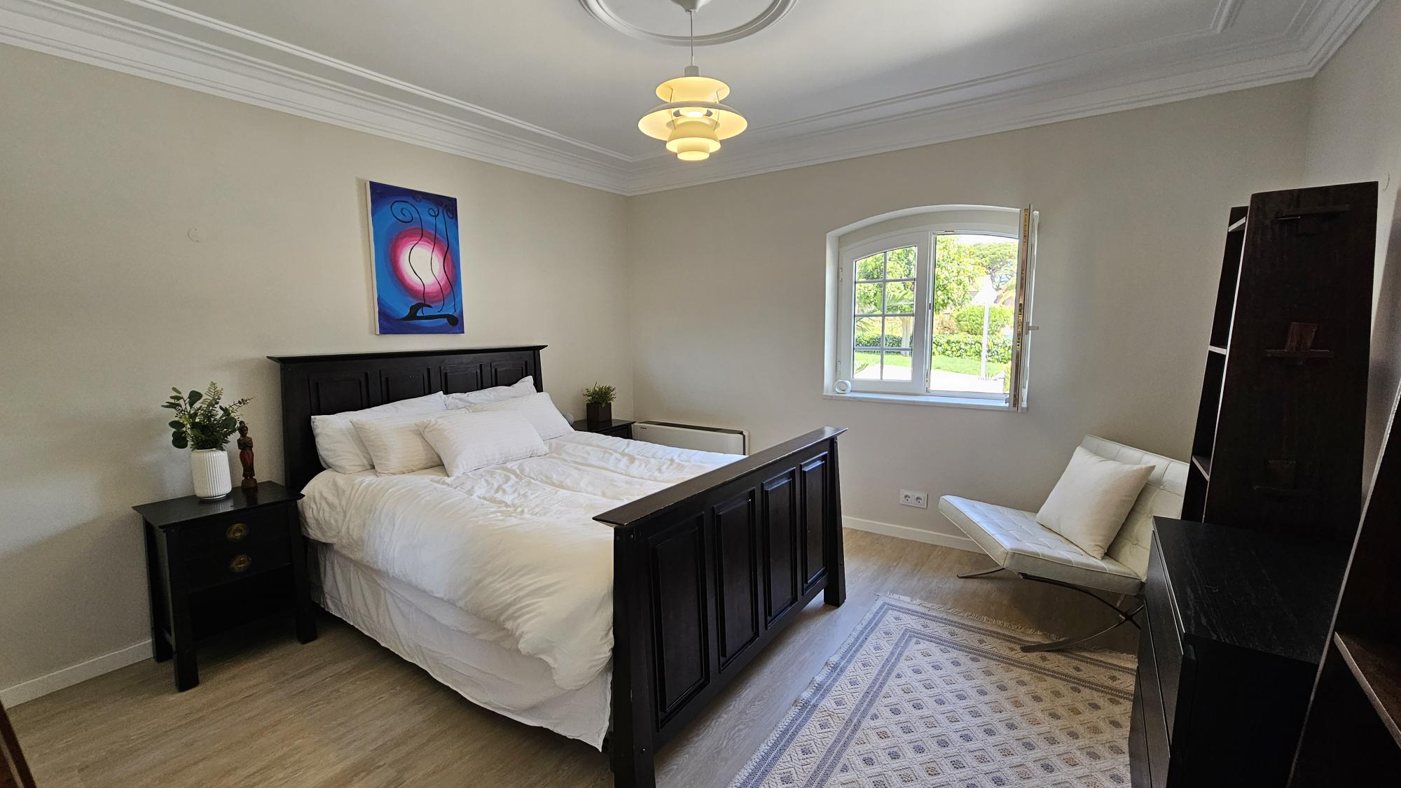 Non-Ensuite Bedroom #7 with dark wood bed