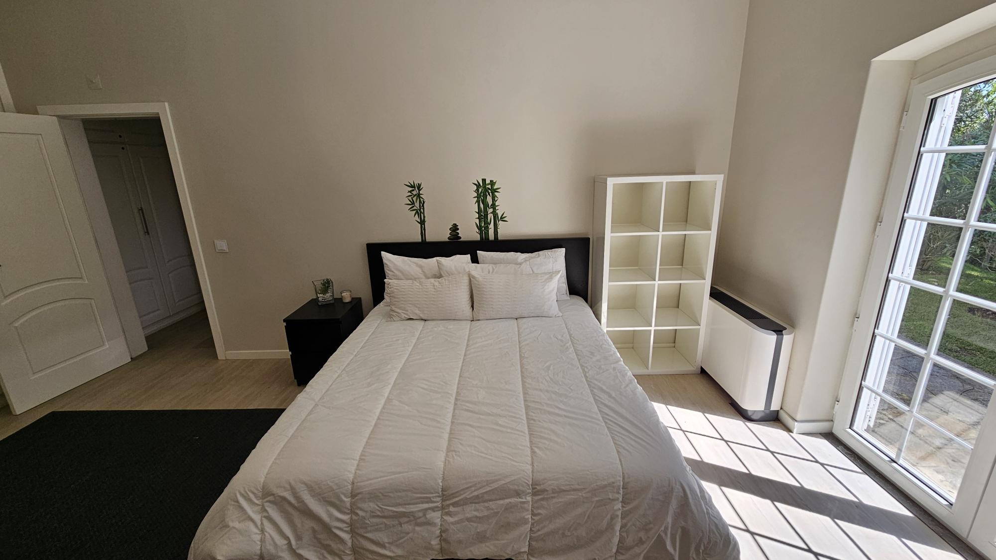 Ensuite Bedroom #3 king bed and garden doors