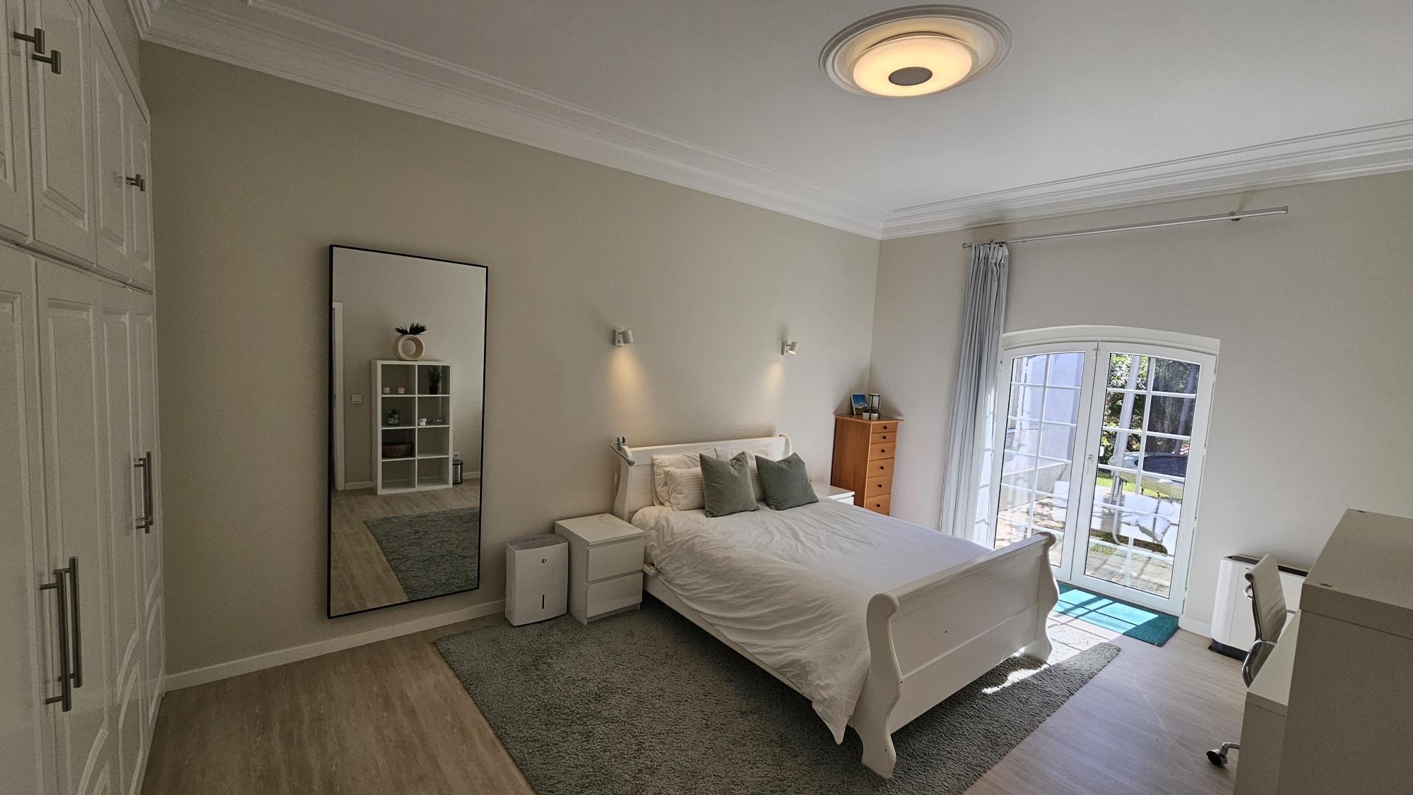 Ensuite Bedroom #4 with white sleigh bed and vinyl records