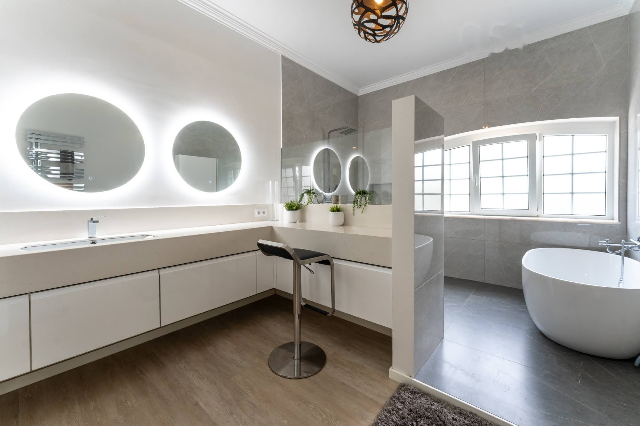 Ensuite Bedroom #4 bathroom with round mirrors, bath and shower