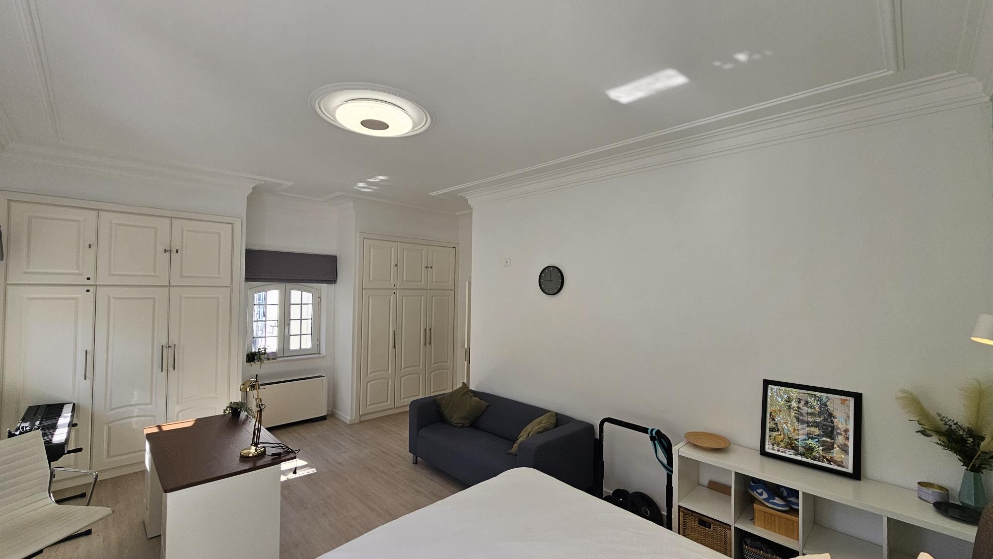 Ensuite Bedroom #5 lounge with sofa and wardrobes