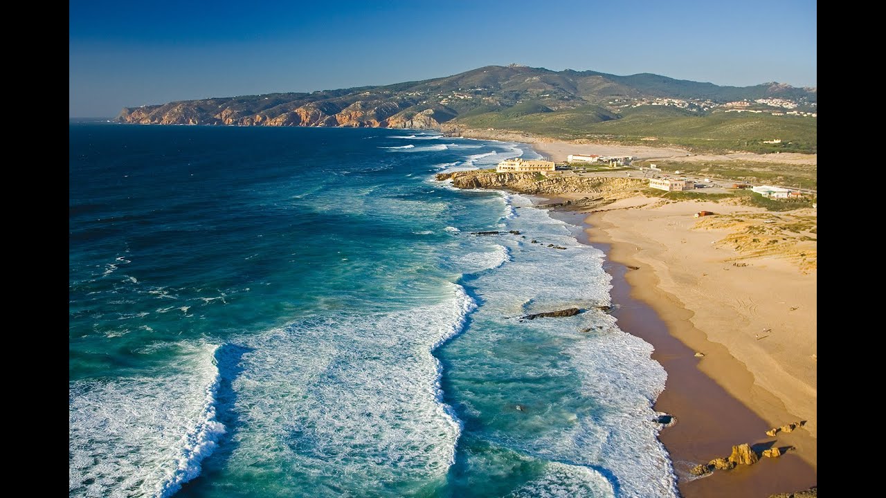 Guincho Beach west of Cascais in open-Atlantic light, a preferred surf beach in autumn