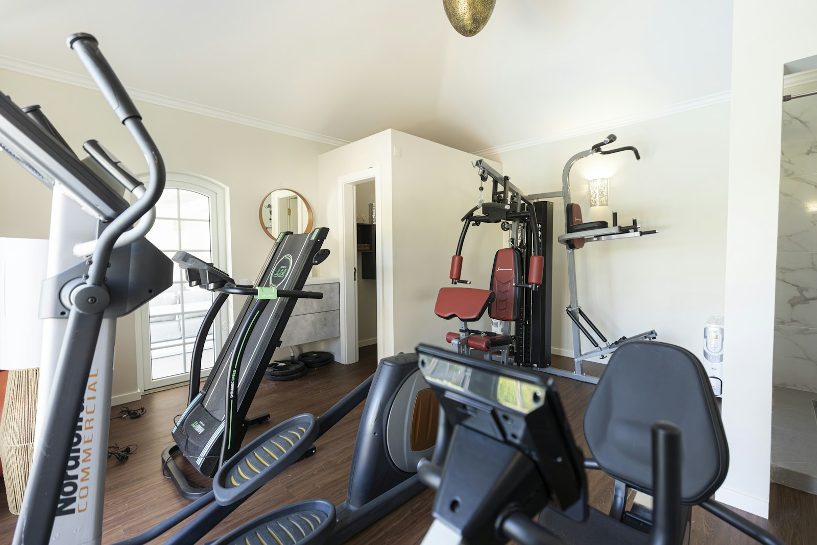 NordicTrack elliptical, treadmill and weights in the villa gym at Cascais Vacation, Cascais, Portugal